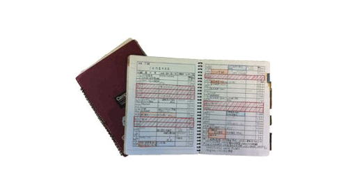 Handwritten notebook containing records