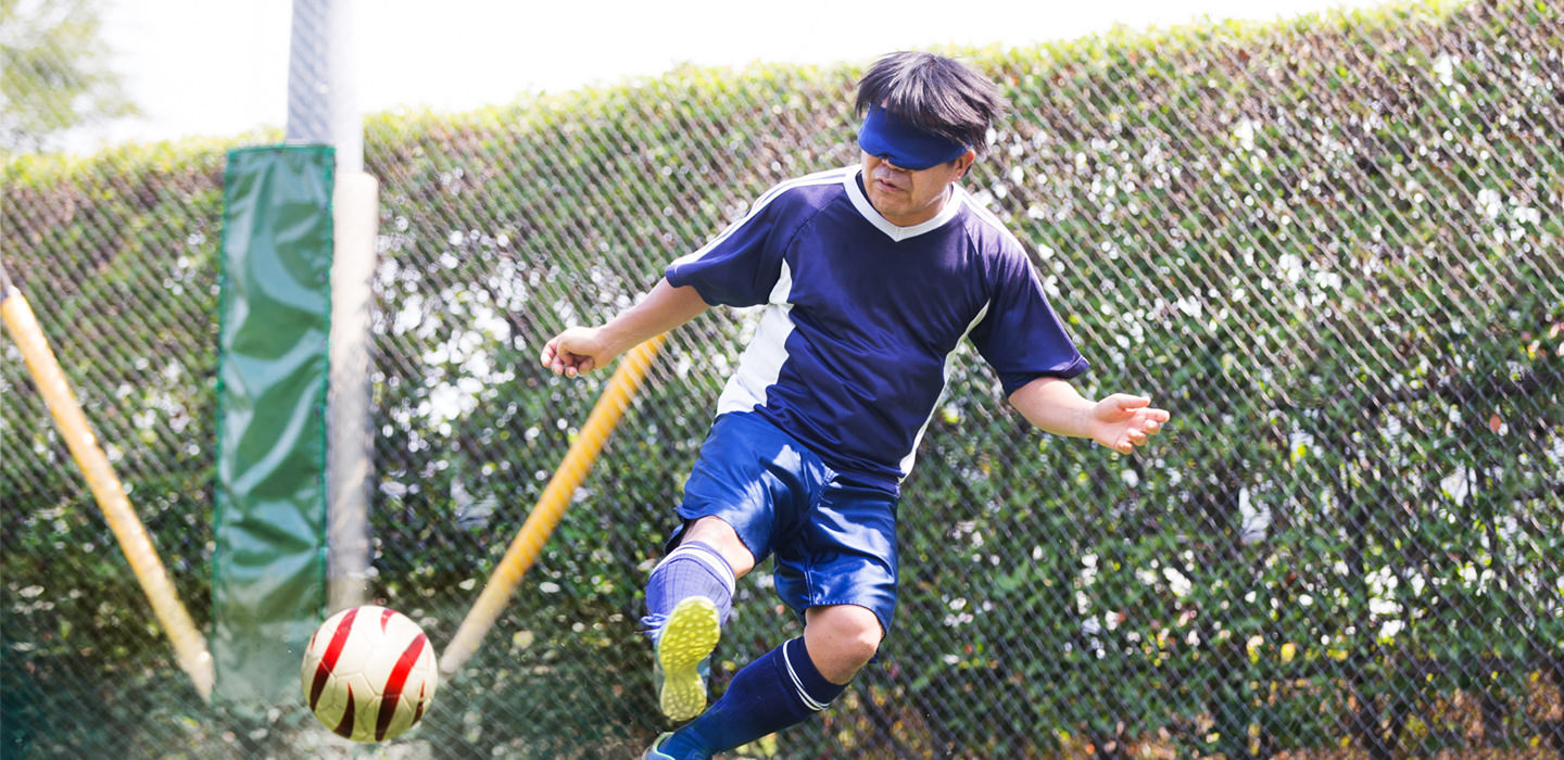 Image: Photograph of Blind footballer Akihito TANAKA during a match.