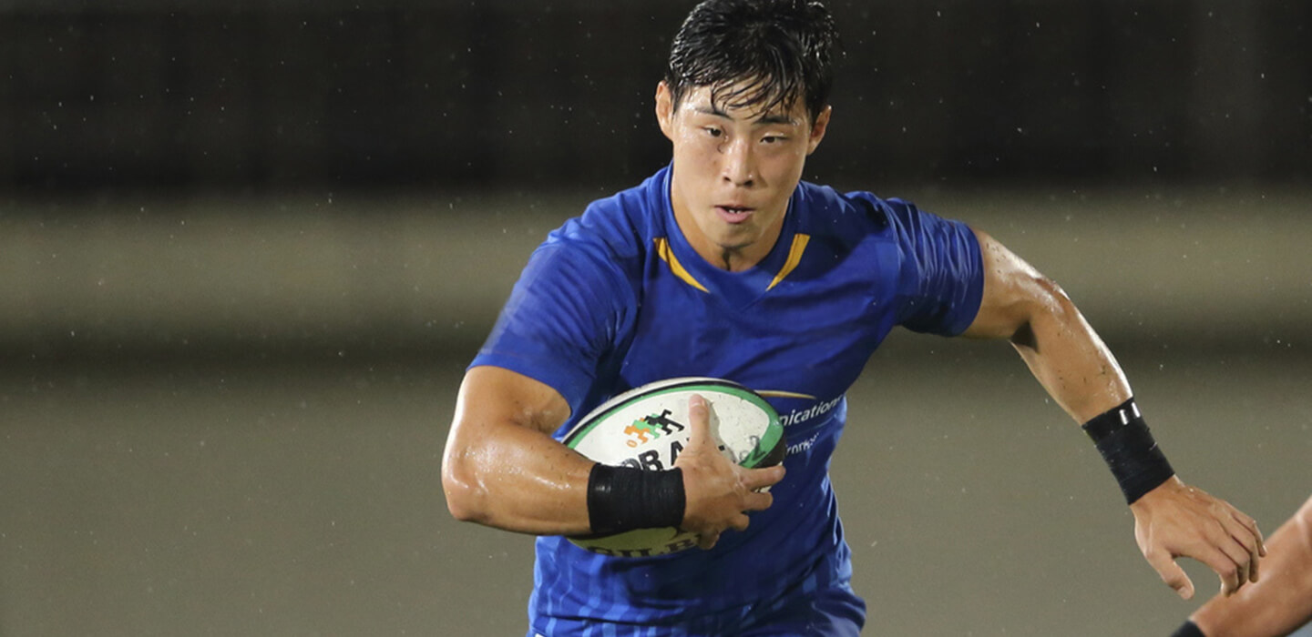 Image: Photograph of rugby player Chang YONGHEUNG in action.