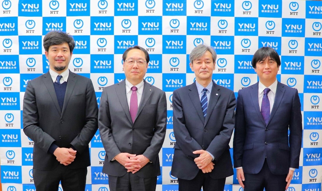 From left to right: Masaki Hisada, Senior Research Engineer / Group Leader of Global Environmental Futures Forecasting Technology Group, NTT Space Environment and Energy Laboratories; Yuji Maeda, Vice President/Head of NTT Space Environment and Energy Laboratories; Izuru Umehara, President, YNU; Hironori Fudeyasu, Professor and Director, TRC