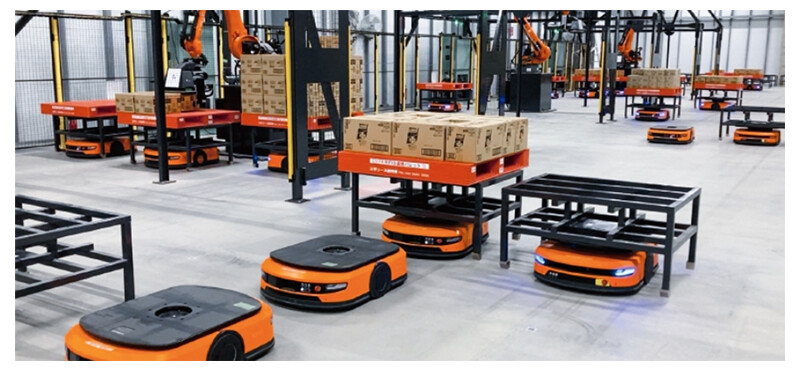 Image of various industrial robots working in a warehouse