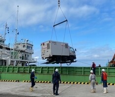 Transport by ship of mobile power supply trucks photo
